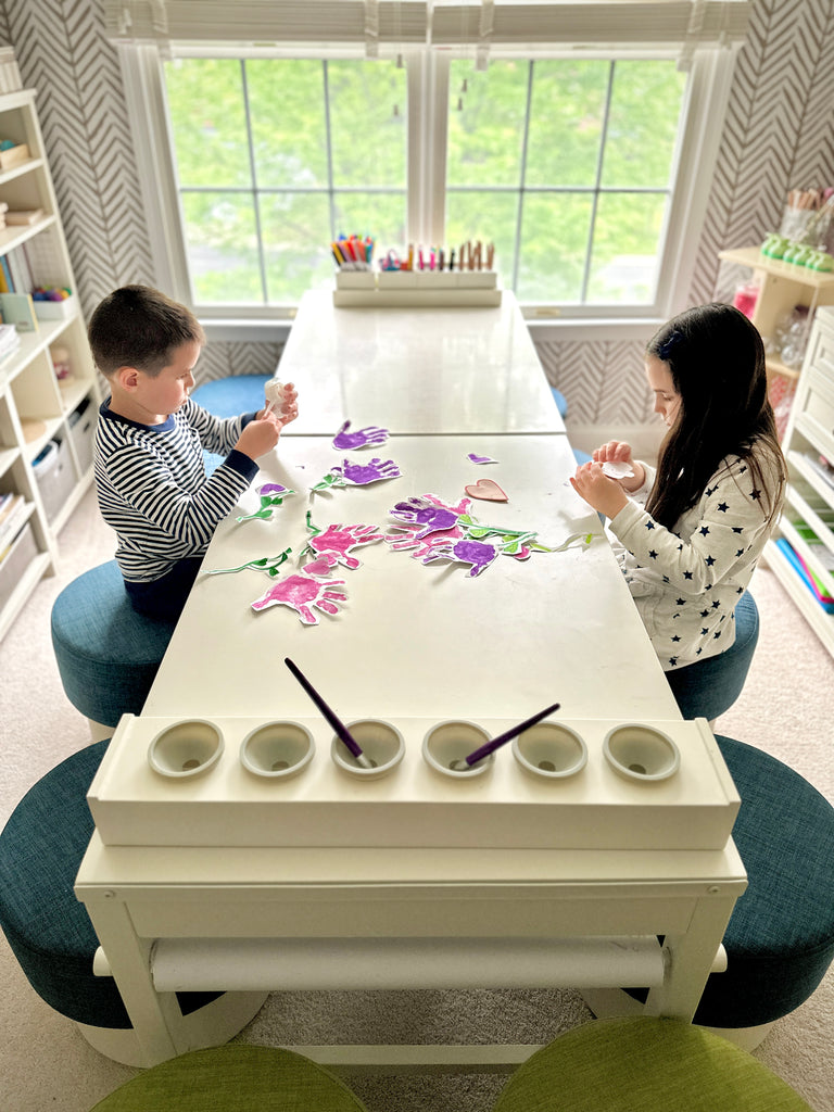 Siblings crafting at Martha Stewart Crafting Kids' Art Tables