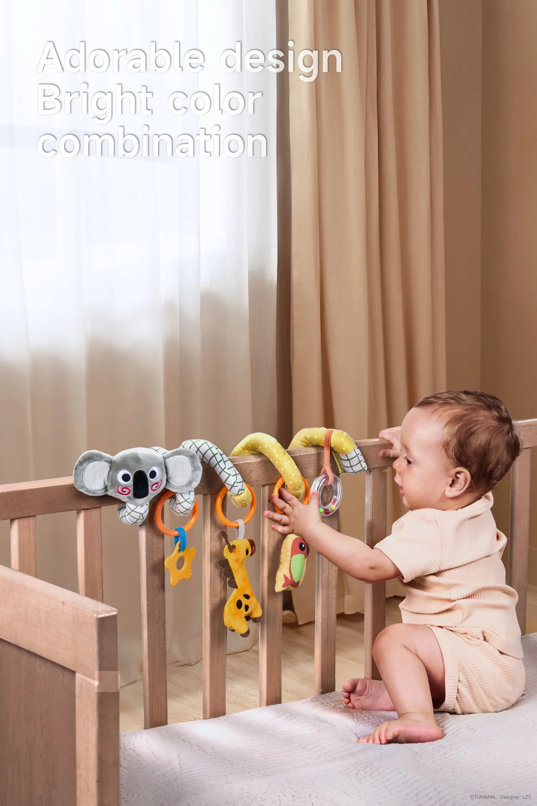 A baby in a stroller playing with a koala giraffe bird arch baby toy