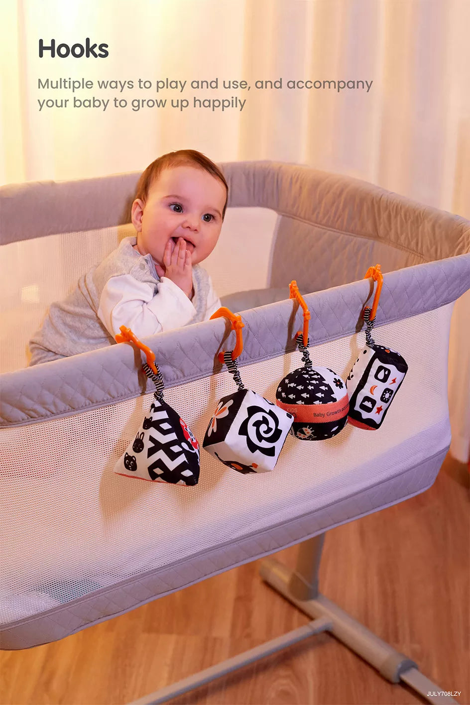 A baby playing with a baby high contrast shape set toy