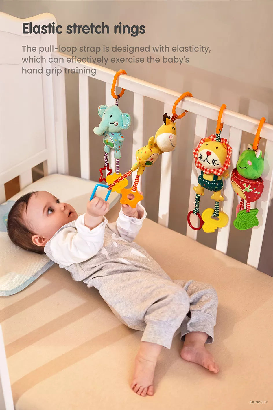 Baby lying in stroller playing with frog deer elephant lion baby toy