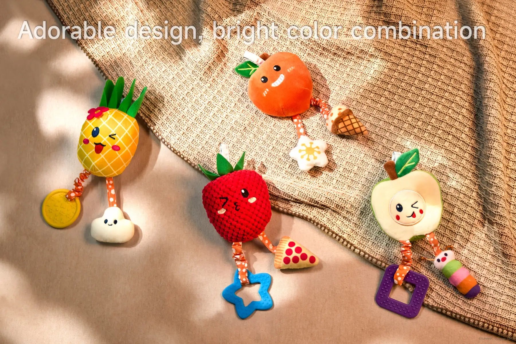 Hanging fruit rattles for sensory play in crib and stroller