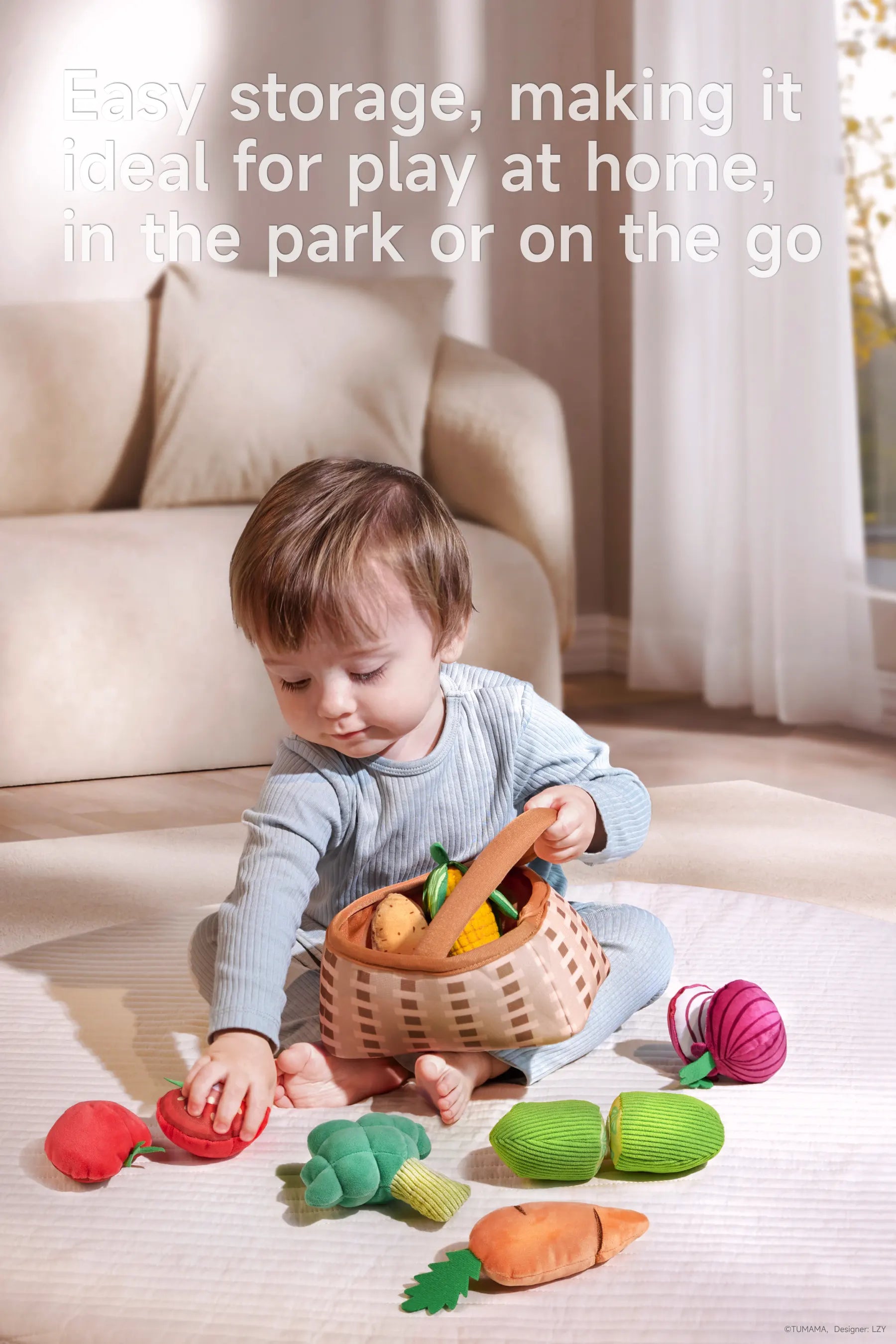 Baby sits on the floor with a basket of colorful felted vegetable toys—strawberry, tomato, carrot, onion, and broccoli.