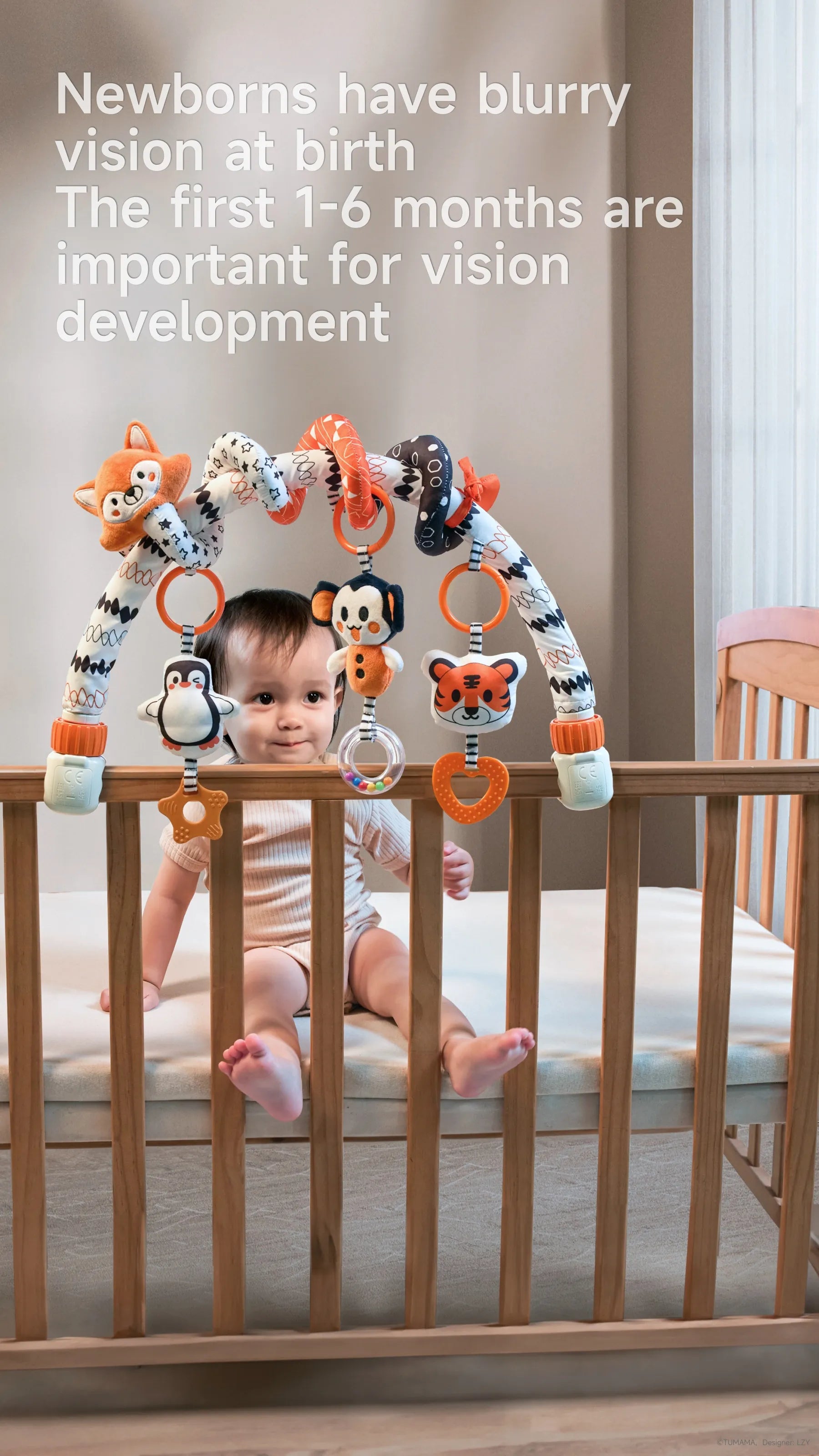 A baby sits in a crib with an arch of high-contrast animal toys, including a fox, tiger, and penguin, designed for visual and sensory stimulation.