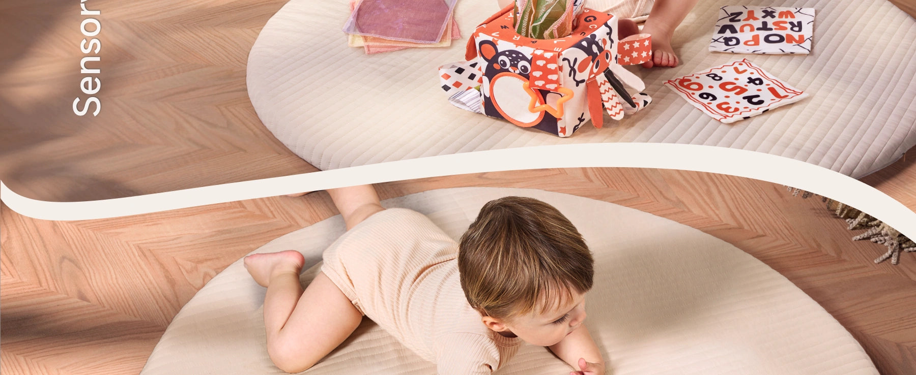 Baby on play mat engaging with sensory tissue box toy and high-contrast soft flash cards, promoting tummy time and early motor skill development