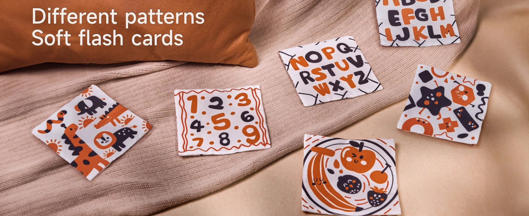 Set of soft flash cards with different patterns including animals, numbers, alphabet, shapes, and fruits, designed for baby sensory learning and early development