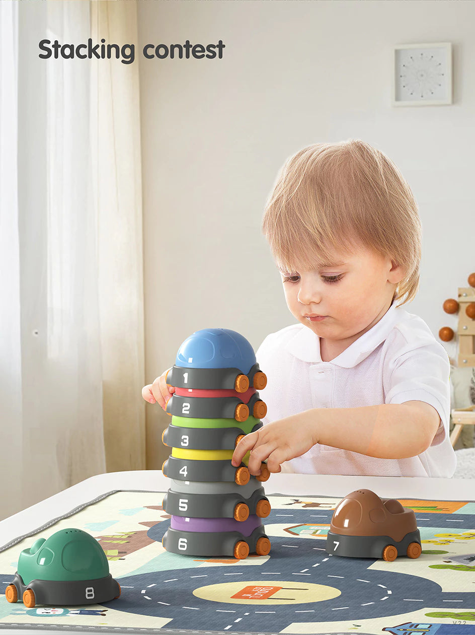 Toddler_s playtime with stacking car toy and activity mat