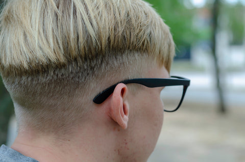 Teenage boy with shaved back and sides haircut