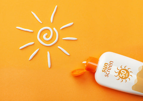 Sunscreen bottle with product used to create a line drawing of the Sun