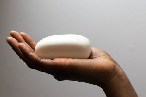 bar of white soap in a hand
