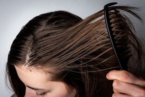 Combing through teenage oily hair