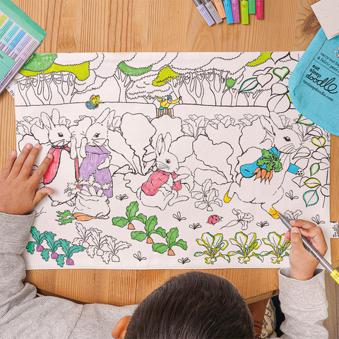 Image depicting a colour in kids placemat with peter rabbit and friends design to colour-in and wash out