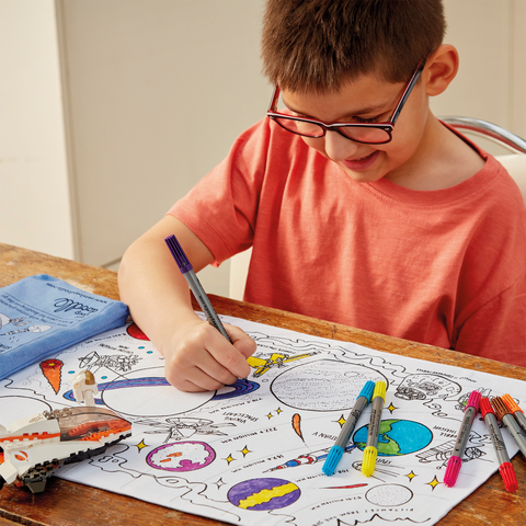 Image depicting a colour in kids placemat with space explorer design to colour-in and wash out