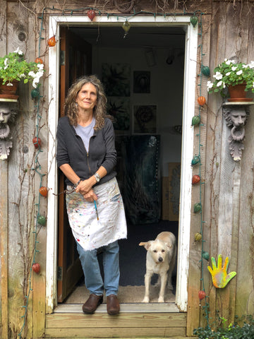 Dede Lifgren standing in the doorway of her studio.