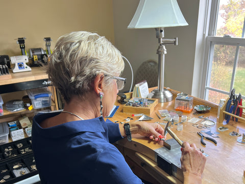 Diana Hirschhorn works at her bench in her jewelry studio