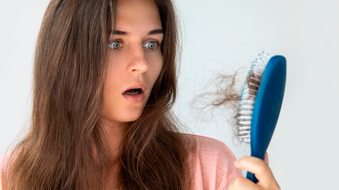 girl uses hair loss products 