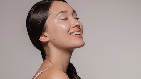 A girl uses the best skin care products to get glowing skin 