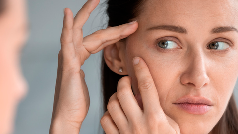 A girl uses the best antiaging creams to reduce wrinkles