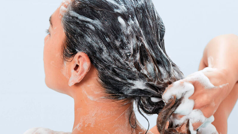 Girl uses sulfate-free shampoo 