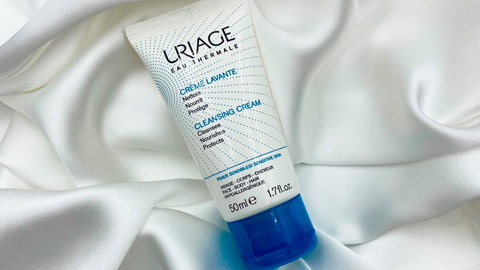 A girl uses Uriage Creme Lavante Cleansing Cream