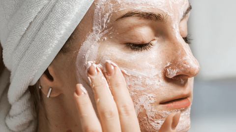 A girl uses the best face scrub for her 20s to maintain skin health