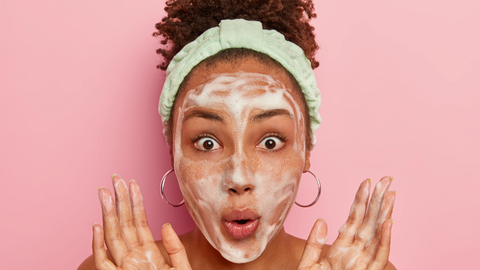 A girl applies a glass skin cleanser