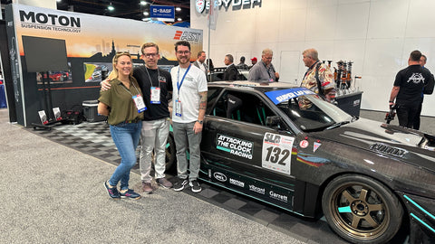 Chris & Nicole with Shawn and R32 at SEMA 22 Moton Booth