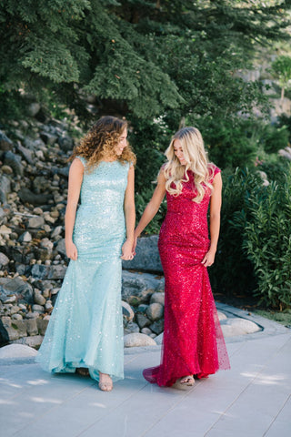 Two girls wearing modest prom dresses