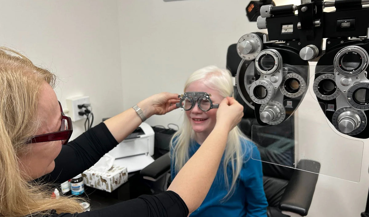 Dr Ana Juricic in her office with one of her patients she is a girl with Albinism