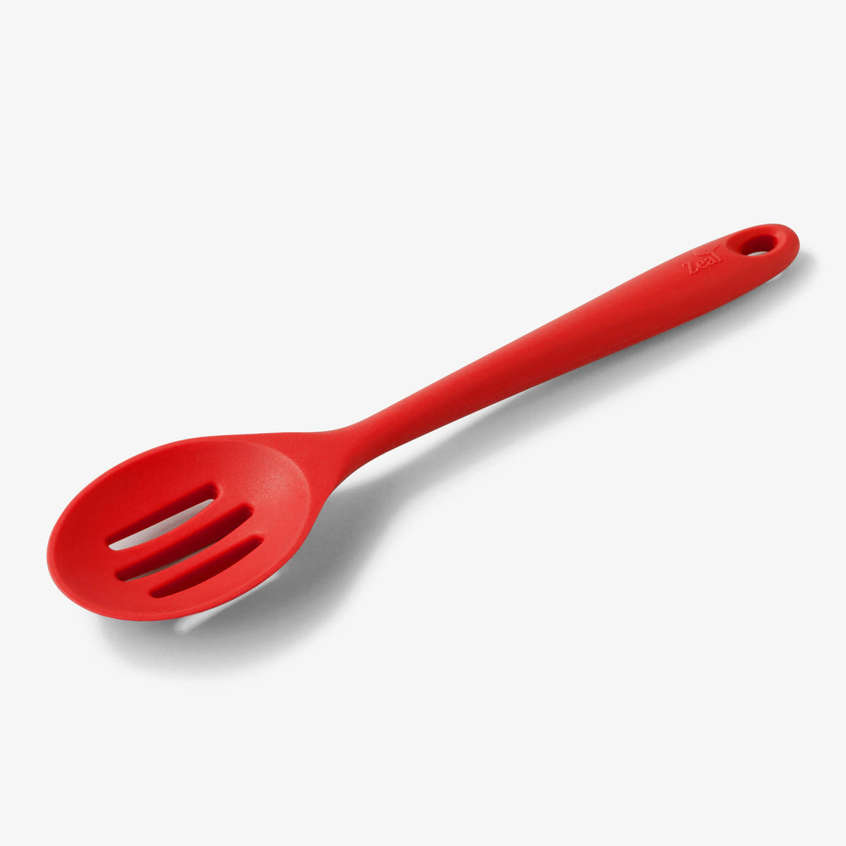 https://cdn.shopify.com/s/files/1/0614/9131/4841/products/j159-zeal-silicone-slotted-spoon-in-red_1200x.jpg?v=1658825562