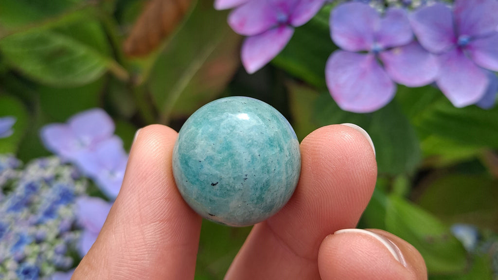 image of an amazonite mini sphere. this healing crystal is available at dumi's crystals