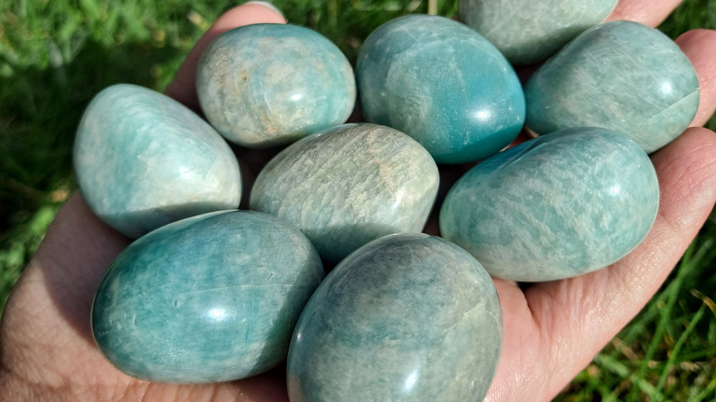 image of amazonite tumbled stones. this crystal is available at dumi's crystals