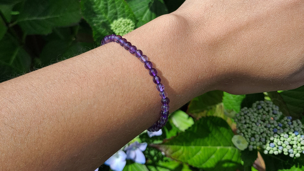 image of an amethyst bracelet made with 4mm beads. This bracelet is available at dumi's crystals
