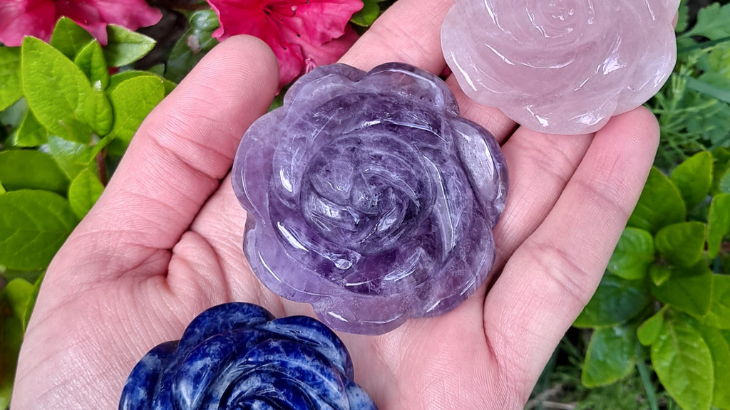 image of an amethyst rose carving. this crystal carving is available at dumi's crystals