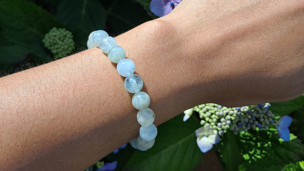 image of an aquamarine bead bracelet. this stretch bracelet is available at dumi's crystals