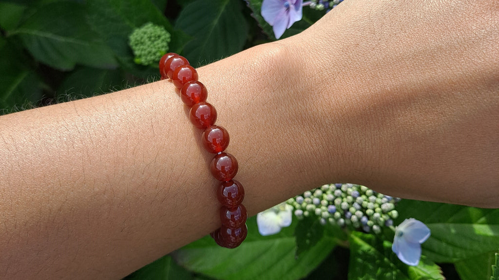 image of a carnelian bead bracelet. this bracelet is available at dumi's crystals
