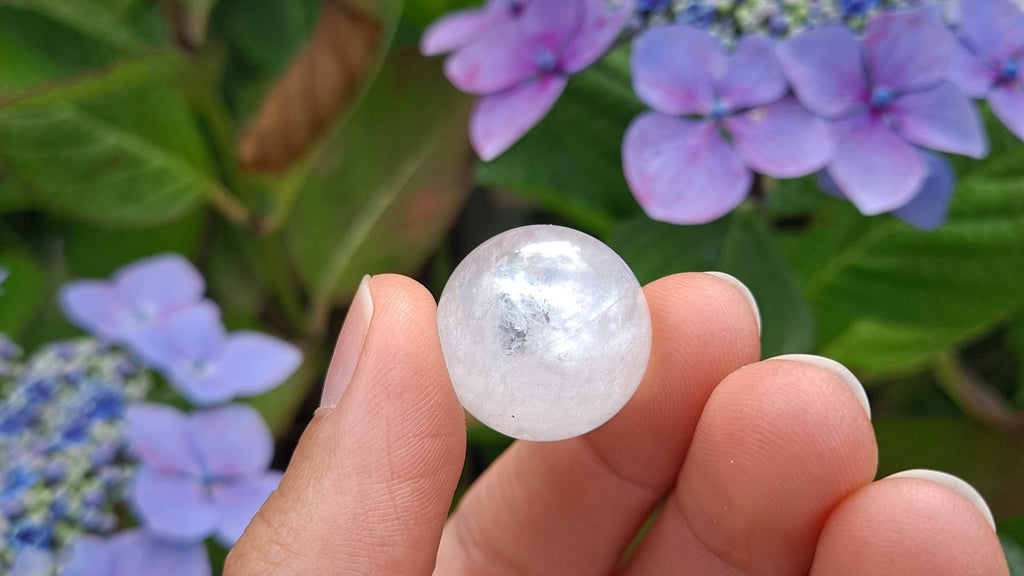 image of a clear quartz 20mm mini sphere. this healing crystal is available at dumi's crystals