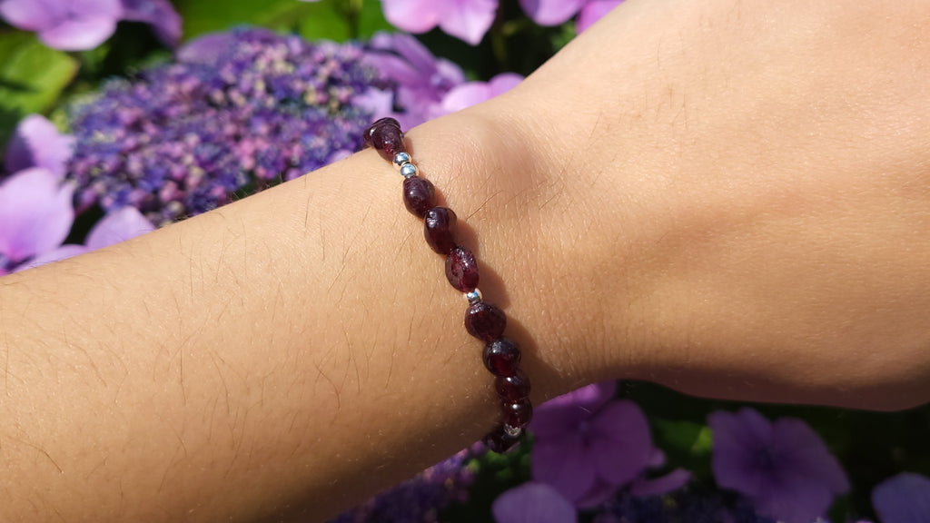 image of a handmade bracelet made with garnet nuggets. this healing crystal is available at dumi's crystals