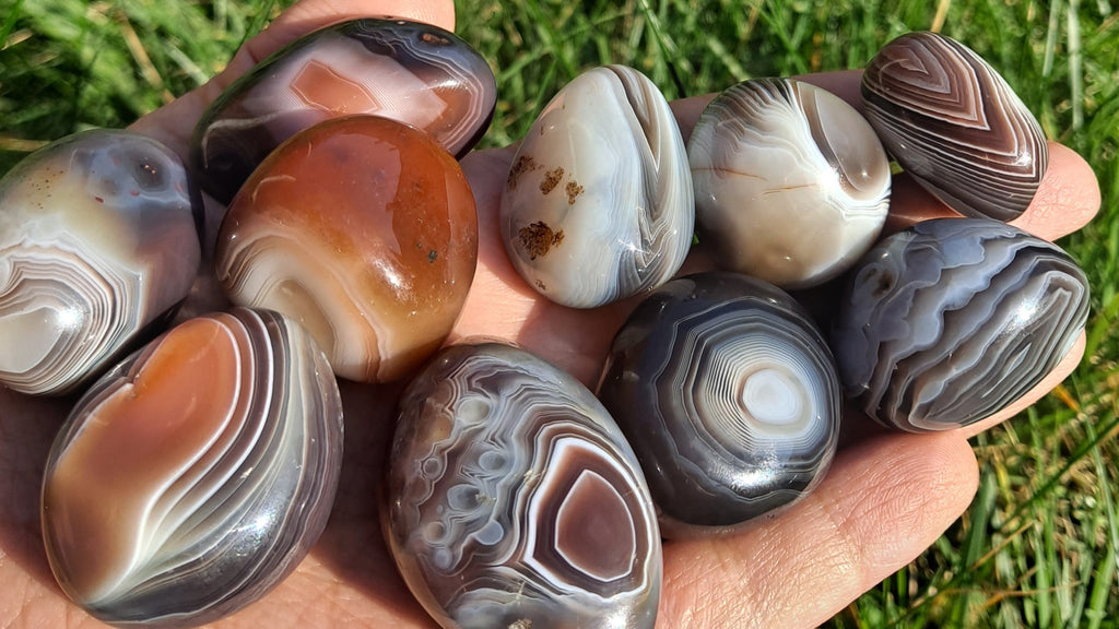 image of persian agate tumble stones. This healing crystal is available at dumi's crystals