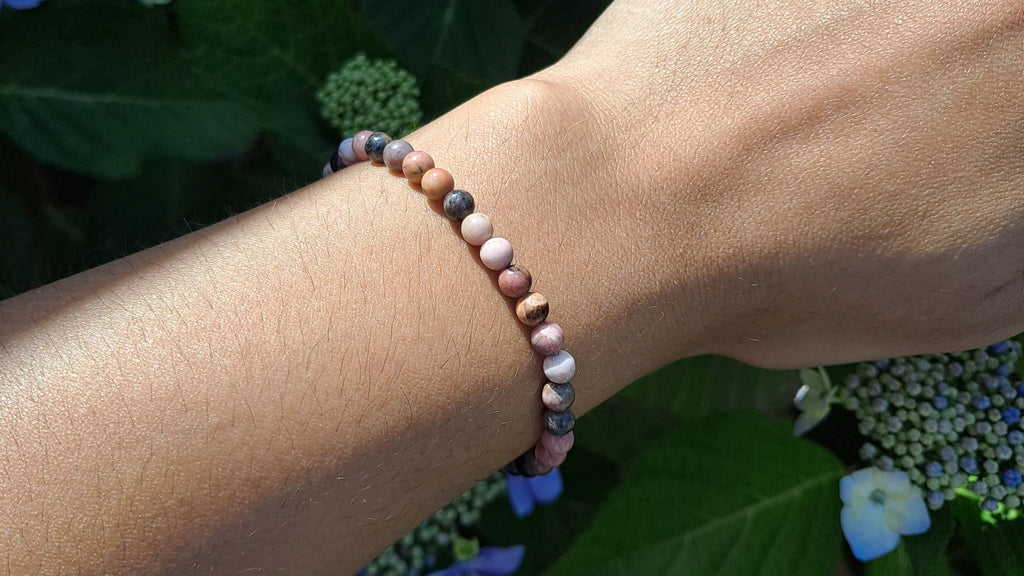 image of a rhodonite 4mm bead bracelet. this healing crystal is available at dumi's crystals