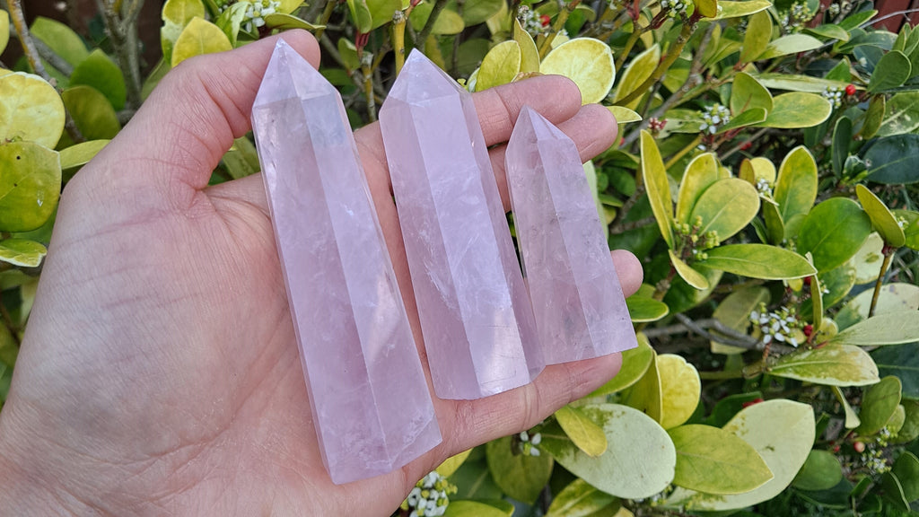 image of 3 rose quartz towers. These towers are available at dumi's crystals