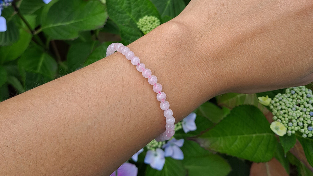 image of a 4mm rose quartz handmade bracelet. This bracelet is available at dumi's crystals