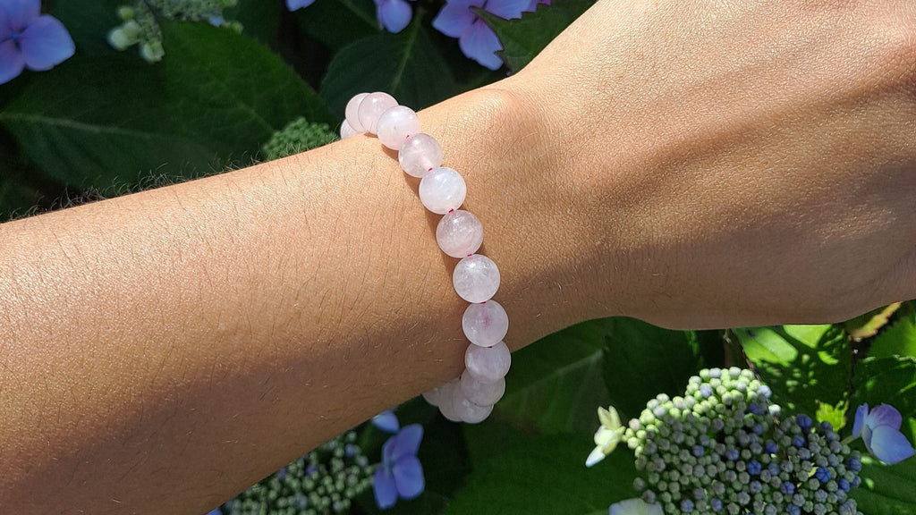 image of a stretch 8mm beads rose quartz bracelet. this healing crystal is available at dumi's crystals