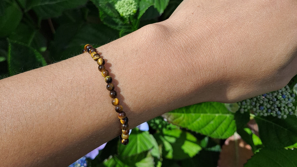 image of a tiger's eye 4mm bead bracelet. this crystal is available at dumi's crystals