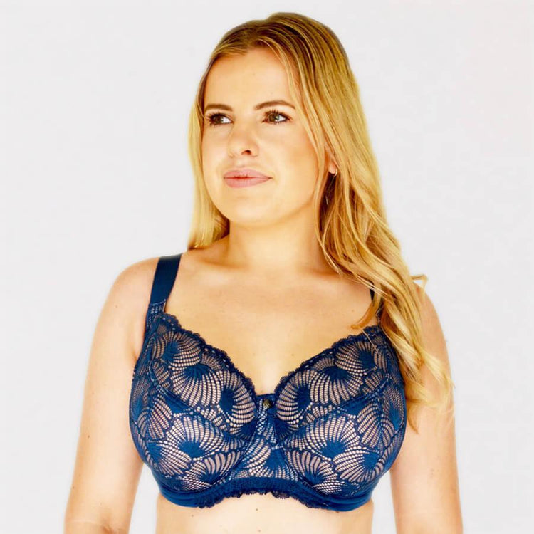 Premium Photo  A woman with dark hair and blue bra with lace trim and a blue  bra.