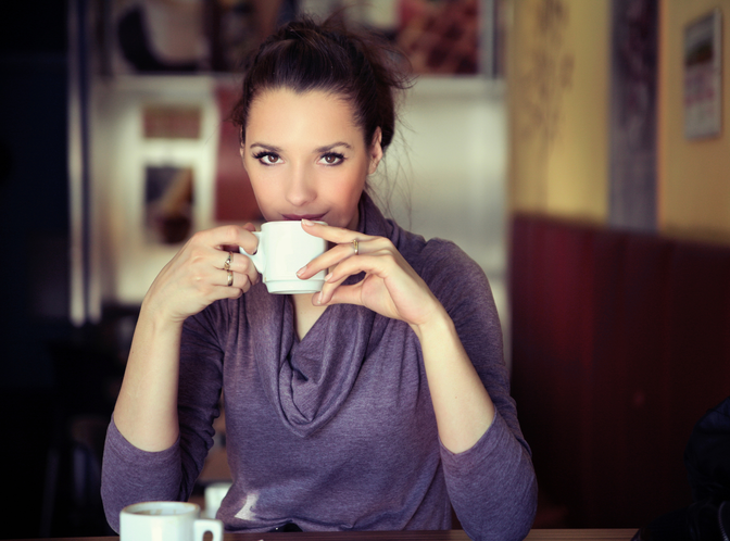 woman drinking decaf coffee