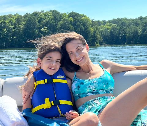 mom and daughter on a boat in the caribbean on vacation