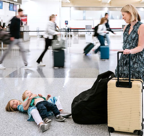 mom with kids having a meltdown in the airport