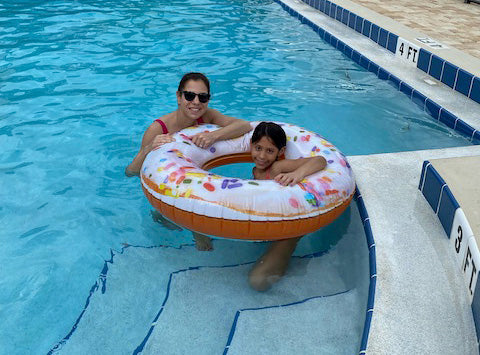 Hair care specialist Jessica Friedman with daughter Madeline in the pool