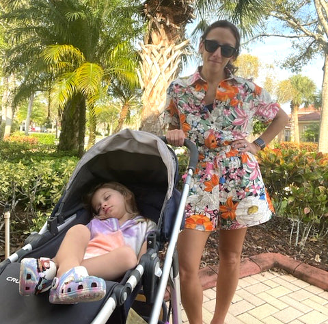 mom with daughter in stroller on vacation