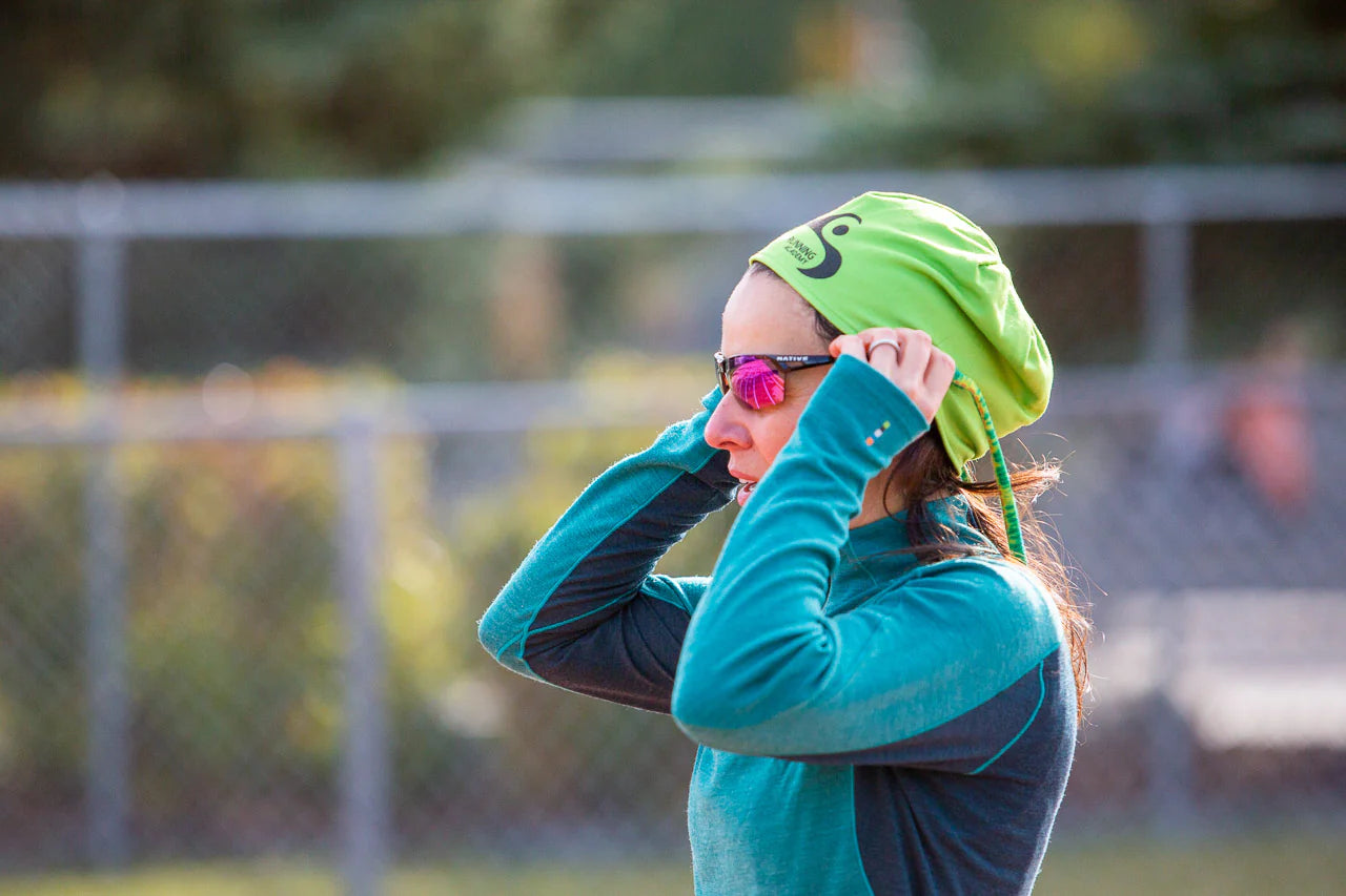 Women in running gear wearing Croakies